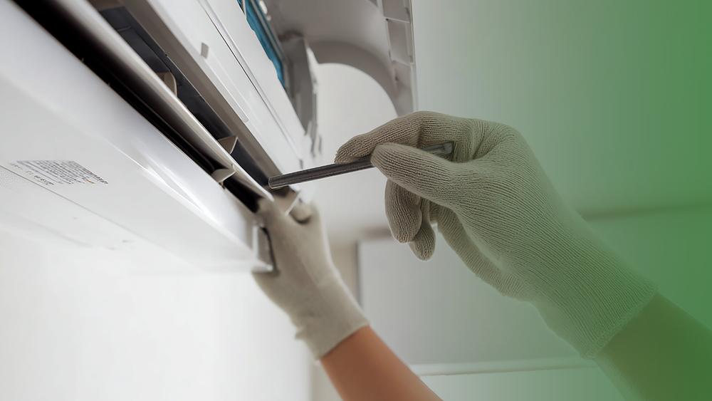 Technician applying coil cleaner to an evaporator—Kor-Chem HVAC chemical solutions for indoor air quality.